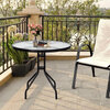 Glass-topped round steel table